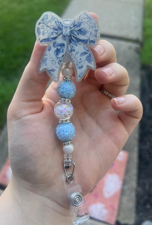 Blue And White Bow Badge Reel